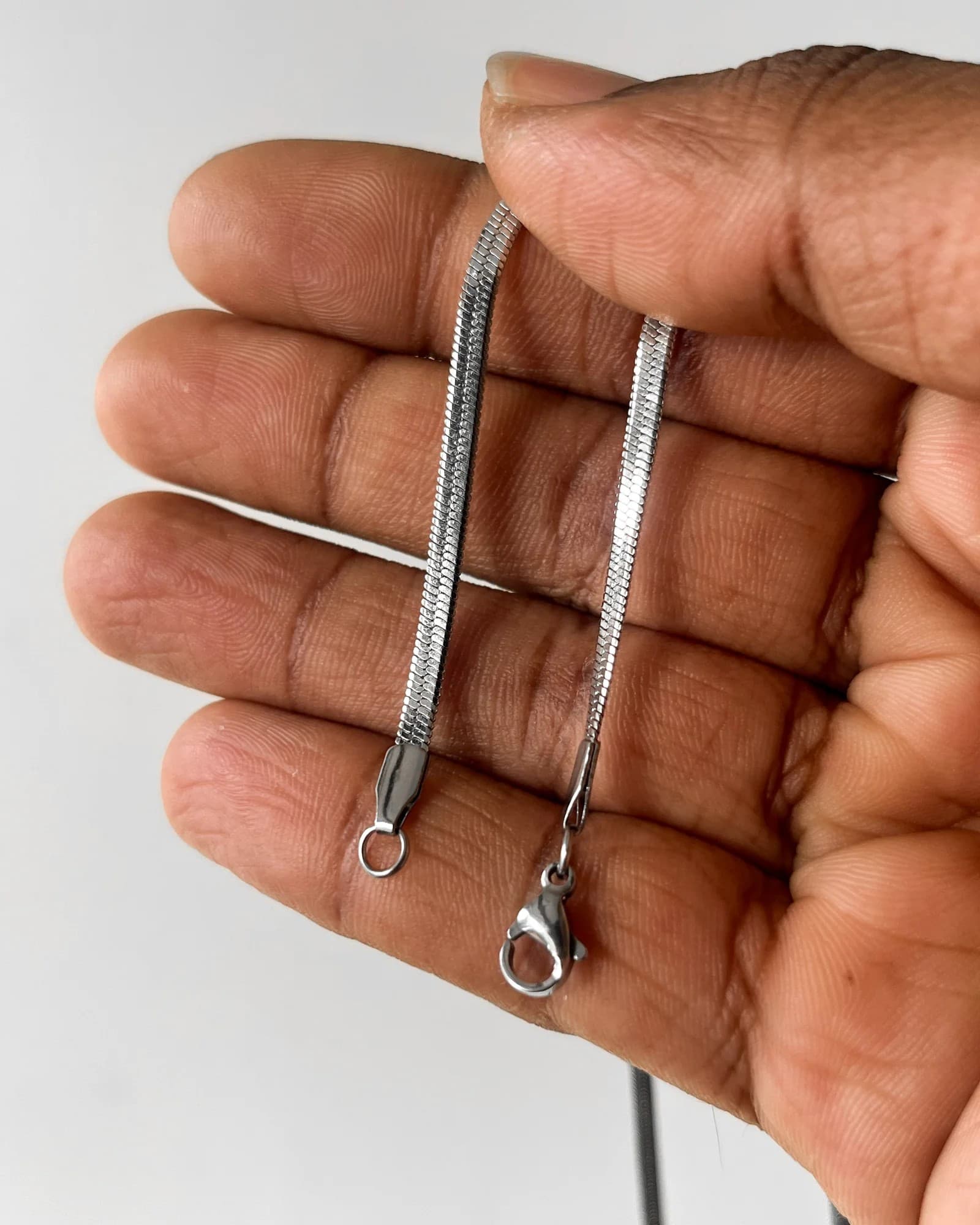 Silver flat snake chain · 18"